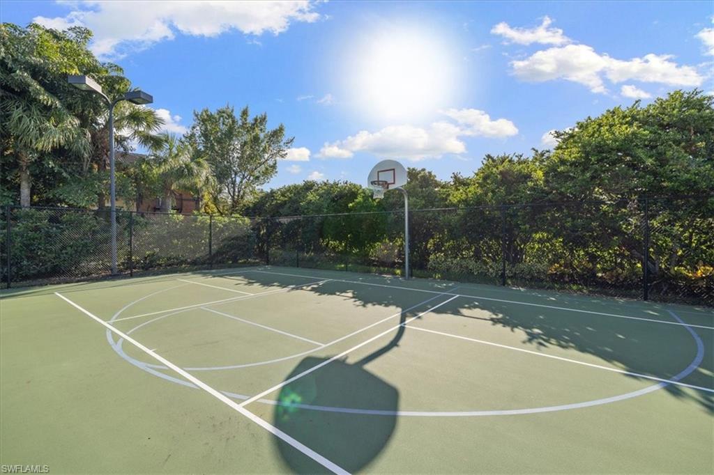 8997 Cambria Circle, Unit 201 Naples, FL 34113 - Photo 30 of 33 a view of a tennis court