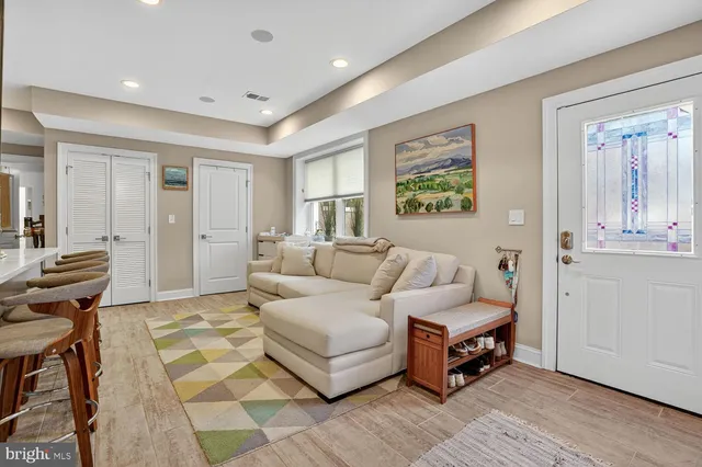 a living room with furniture and a rug