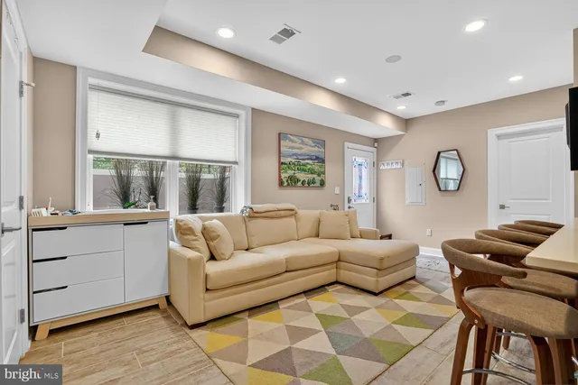 a living room with furniture and a large window