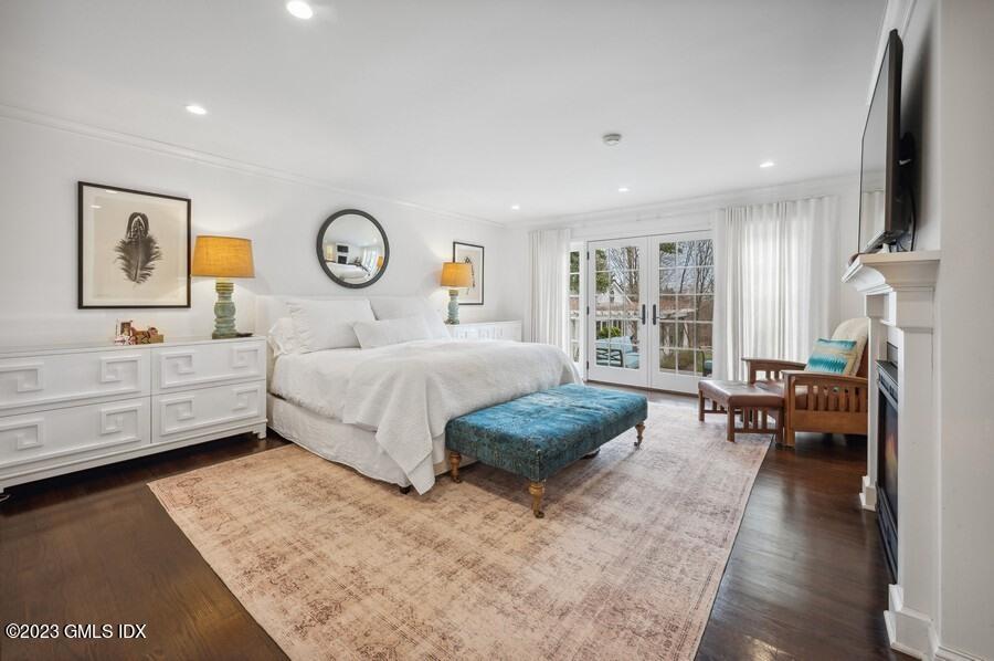 9 Cameron Drive Greenwich, CT 06831 - Photo 19 of 43 a bedroom with a large bed and a couch