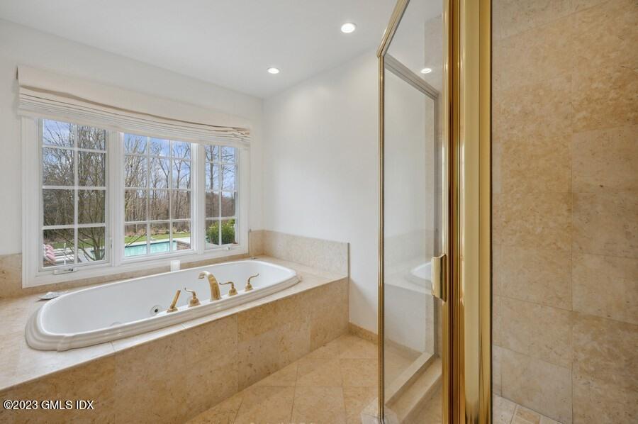 9 Cameron Drive Greenwich, CT 06831 - Photo 21 of 43 a bath tub sitting next to a window