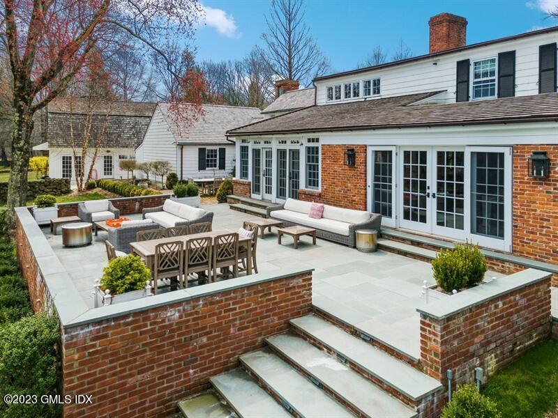 9 Cameron Drive Greenwich, CT 06831 - Photo 24 of 43 a view of a house with backyard and sitting area