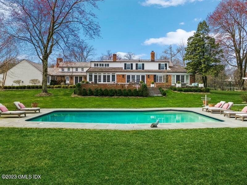 9 Cameron Drive Greenwich, CT 06831 - Photo 26 of 43 a view of a house with a big yard and large trees