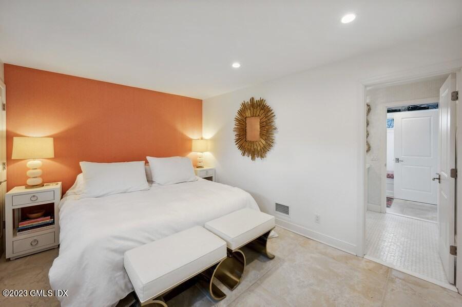 9 Cameron Drive Greenwich, CT 06831 - Photo 31 of 43 a bedroom with a bed and a lamp