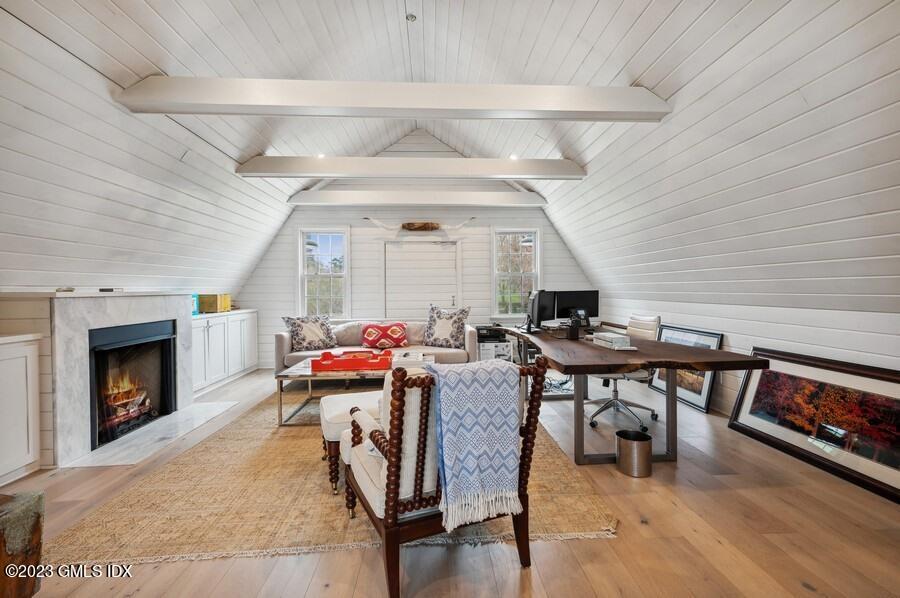 9 Cameron Drive Greenwich, CT 06831 - Photo 35 of 43 a living room with furniture and a fireplace