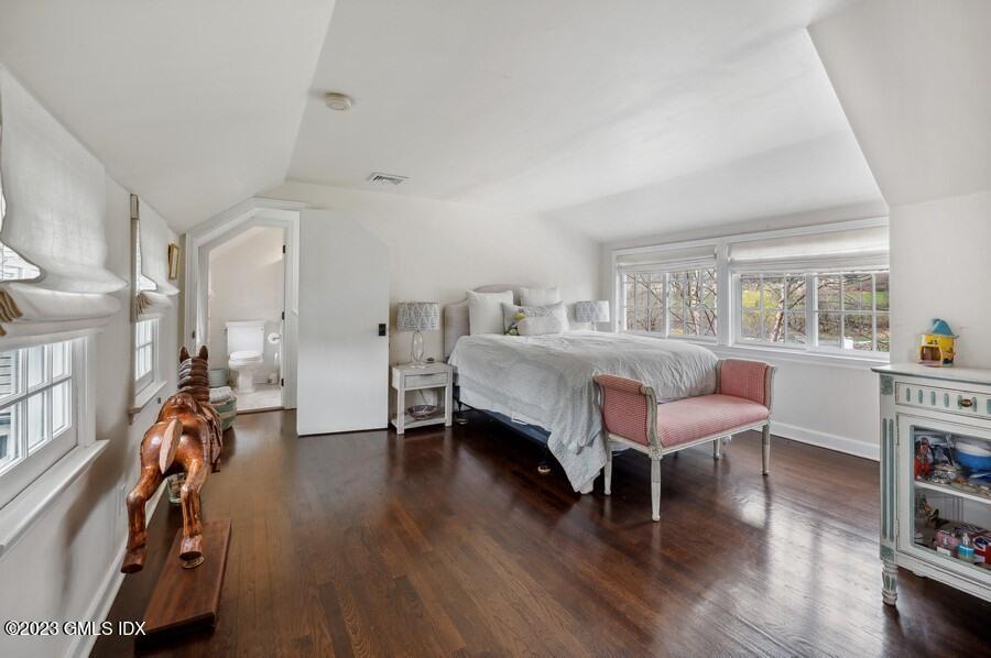 9 Cameron Drive Greenwich, CT 06831 - Photo 39 of 43 a bedroom with furniture wooden floor and a window