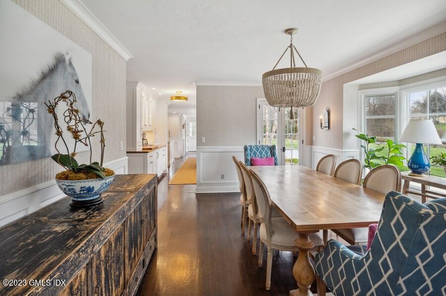 9 Cameron Drive Greenwich, CT 06831 - Photo 6 of 43 a view of a dining room with furniture a chandelier and wooden floor