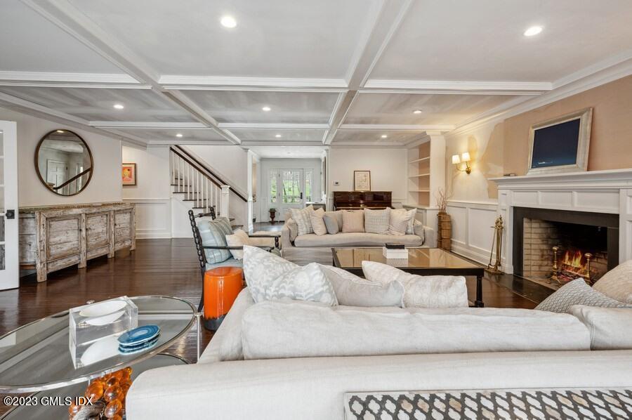 9 Cameron Drive Greenwich, CT 06831 - Photo 8 of 43 a living room with furniture a fireplace and a flat screen tv