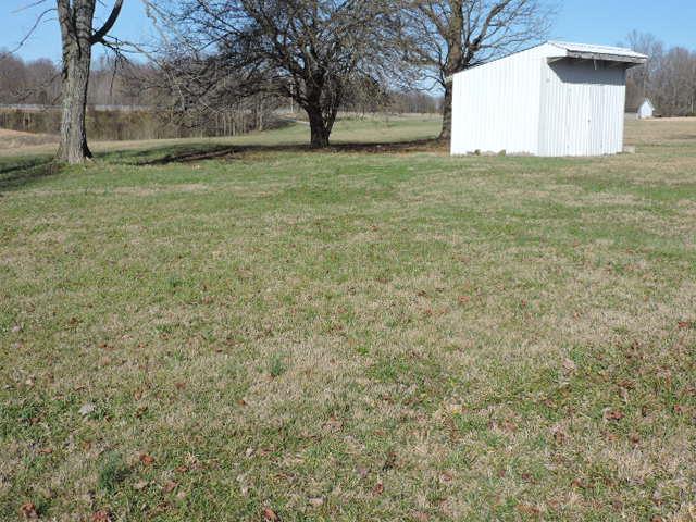 8633 Red Boiling Springs Road Lafayette, TN 37083 - Photo 13 of 16 a view of a house with a yard