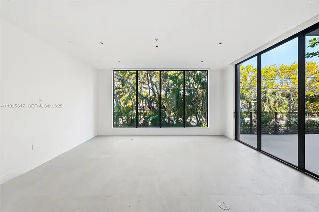 a view of a big room with large windows