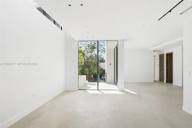 a view of a room with a large window