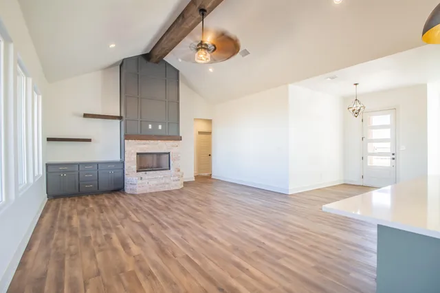 a spacious bathroom with a double vanity sink a mirror and a shower