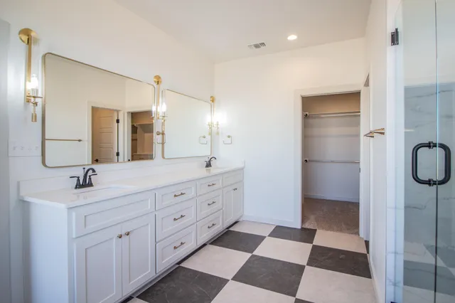 a bathroom with a bathtub and shower