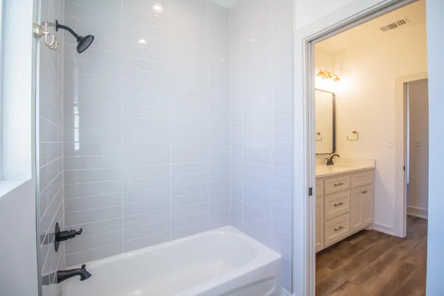 a view of a room with an ocean & mountain in the back