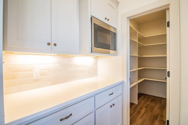 a view of a bathroom from a hallway