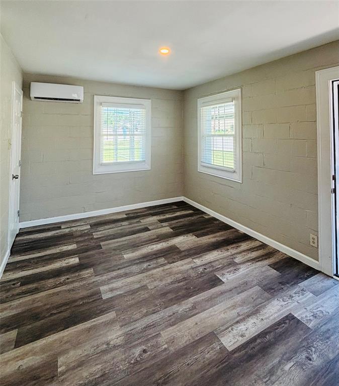260 South Corinth St Road, Unit 260 Dallas, TX 75203 - Photo 3 of 8 a view of a room with wooden floor and window