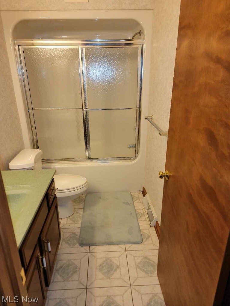 4088 Leffingwell Road Canfield, OH 44406 - Photo 27 of 35 Full bathroom with vanity, shower / bath combination with glass door, and light tile flooring