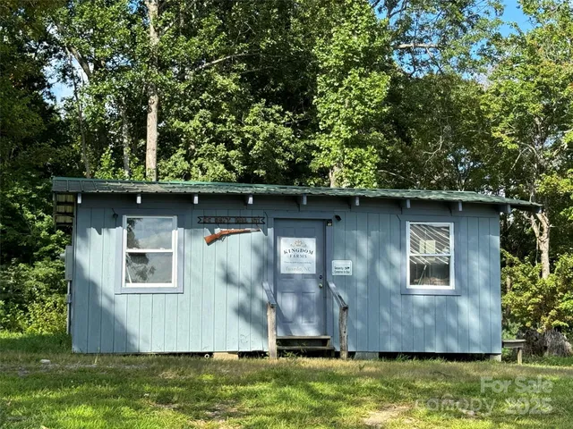 a view of a garden with a bench in the background