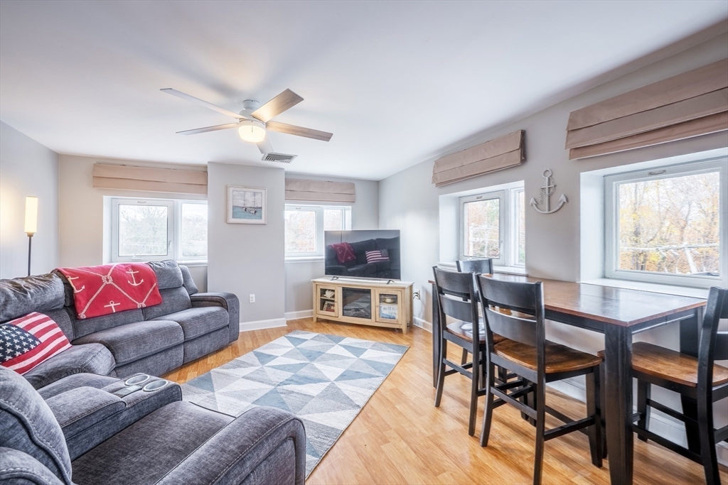 45 Main Street, Unit 38 Wareham, MA 02571 - Photo 16 of 30 a living room with furniture and a flat screen tv