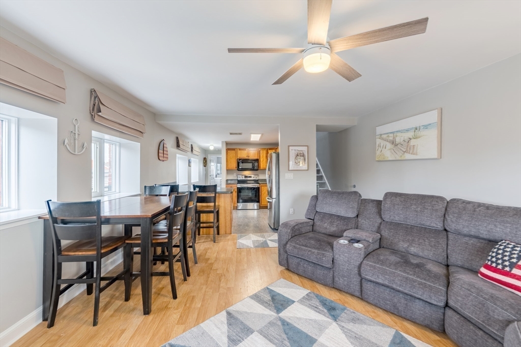 45 Main Street, Unit 38 Wareham, MA 02571 - Photo 17 of 30 a living room with furniture and a wooden floor