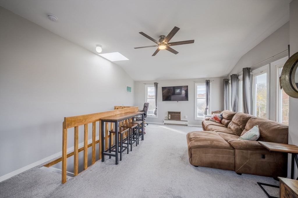 45 Main Street, Unit 38 Wareham, MA 02571 - Photo 21 of 30 a living room with furniture a ceiling fan and a window