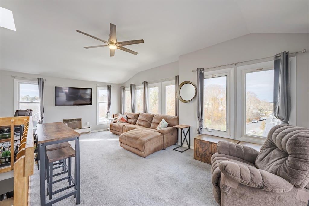 45 Main Street, Unit 38 Wareham, MA 02571 - Photo 22 of 30 a living room with furniture and a flat screen tv