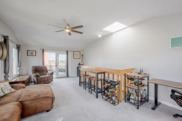 a bedroom with furniture and a window