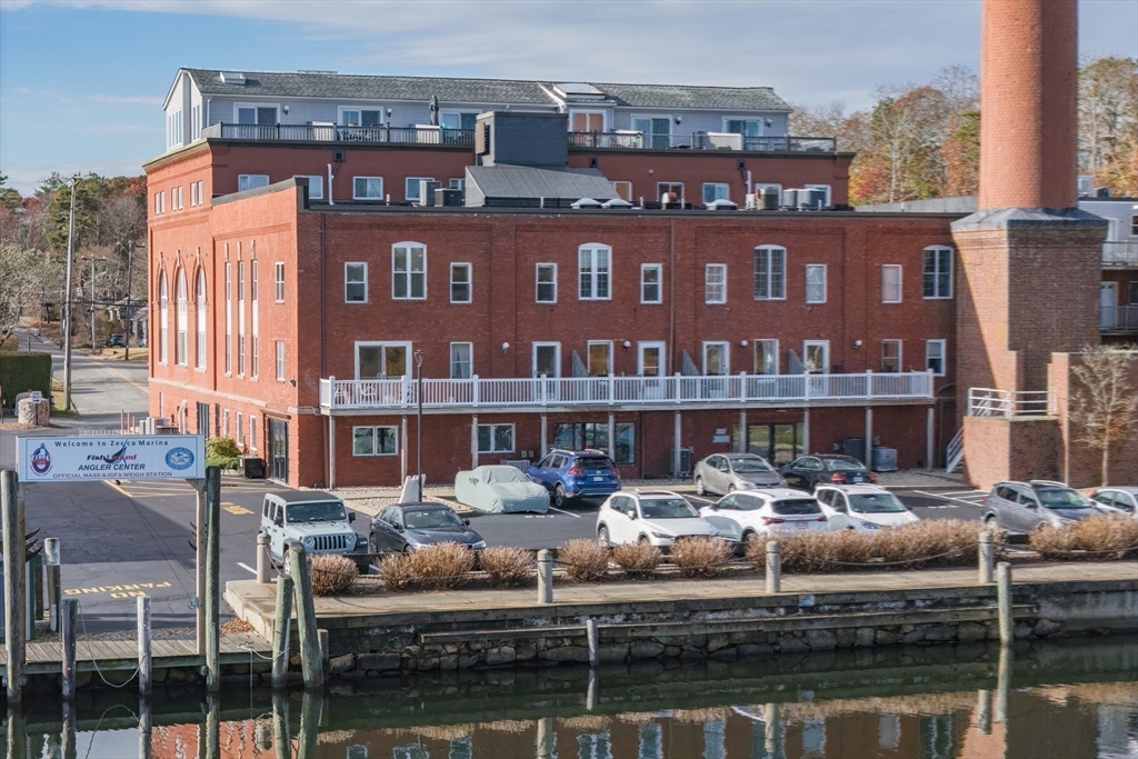 45 Main Street, Unit 38 Wareham, MA 02571 - Photo 25 of 30 a front view of a building with lake view and a fountain