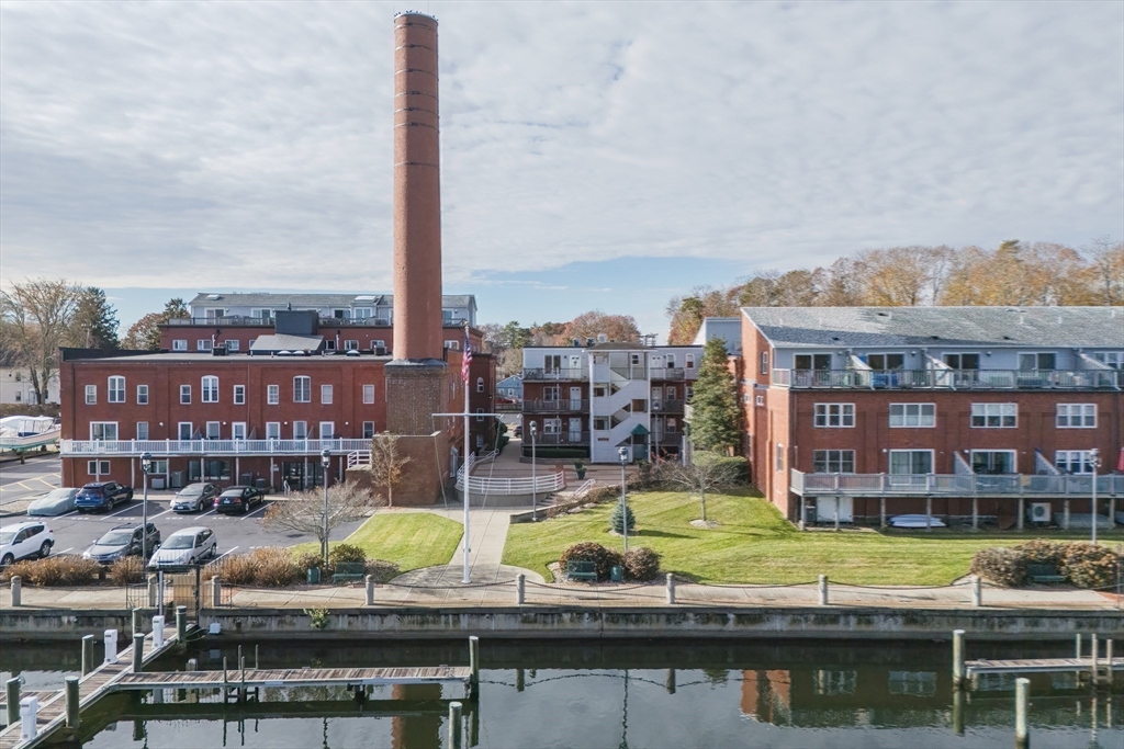 45 Main Street, Unit 38 Wareham, MA 02571 - Photo 26 of 30 a view of swimming pool with outdoor seating space and city view