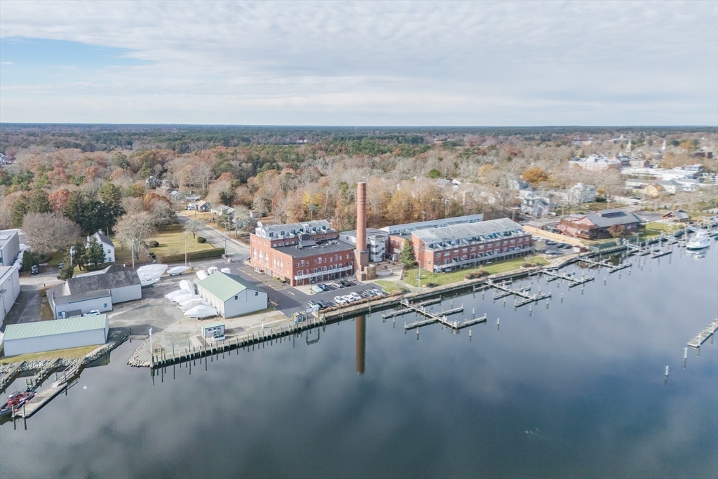 45 Main Street, Unit 38 Wareham, MA 02571 - Photo 28 of 30 an aerial view of residential houses with outdoor space