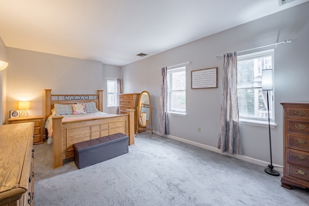 45 Main Street, Unit 38 Wareham, MA 02571 - Photo 10 of 30 a bedroom with a bed and a window