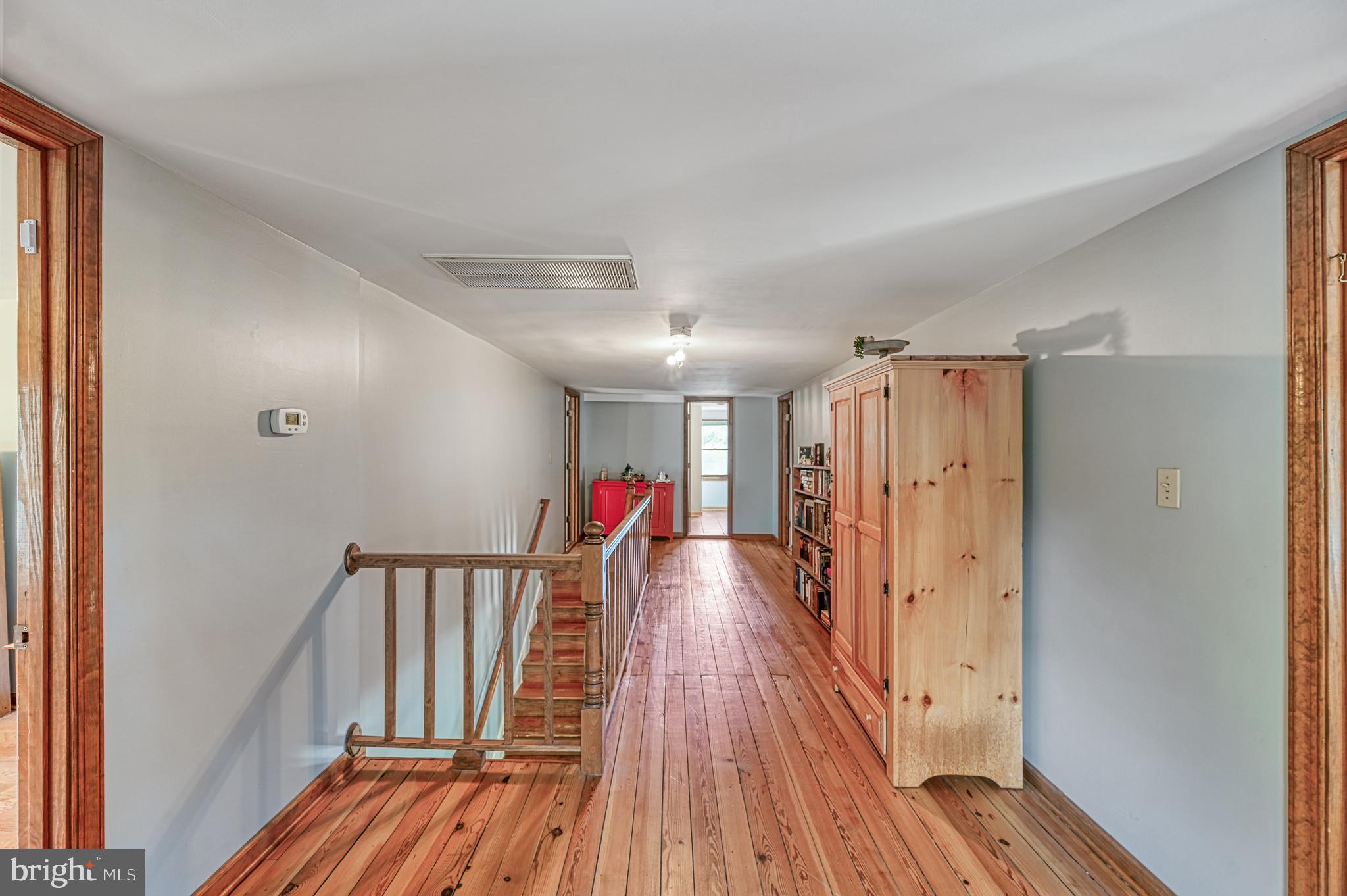 3492 Roundabout Road Louisa, VA 23093 - Photo 27 of 35 a view of a hallway with wooden floor and stairs