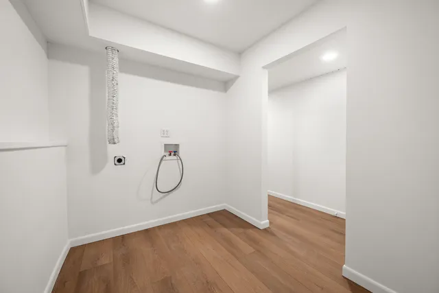 a view of a porch with furniture and a yard