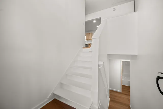 a view of entryway with wooden floor