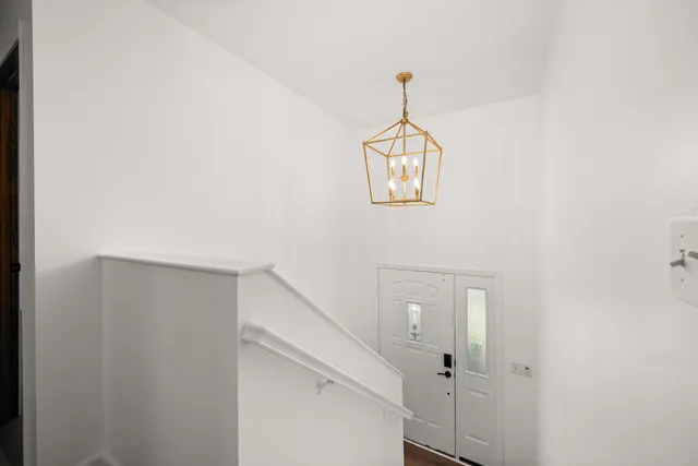 a view of a hallway with a white walls