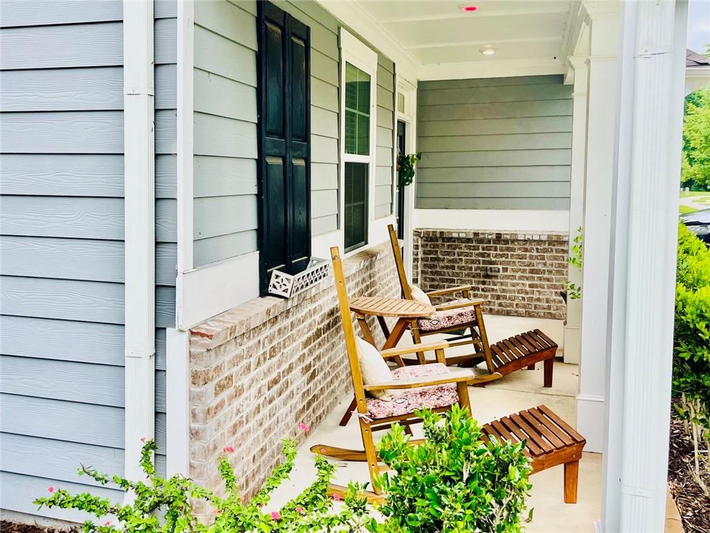 3015 Winding Ridge Waleska, GA 30183 - Photo 4 of 40 a balcony with table and chairs