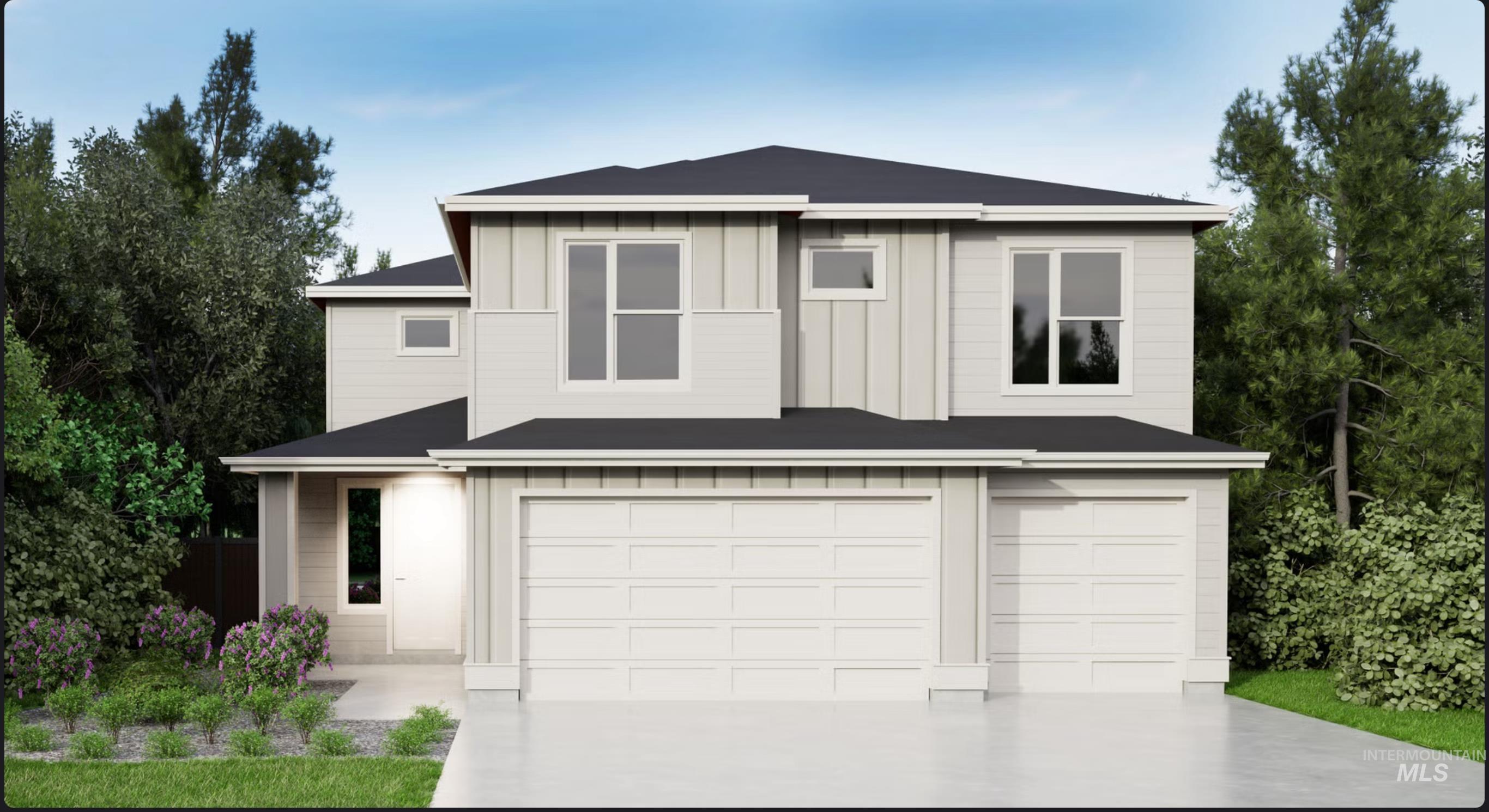 View of front of home with board and batten siding, a garage, and concrete driveway