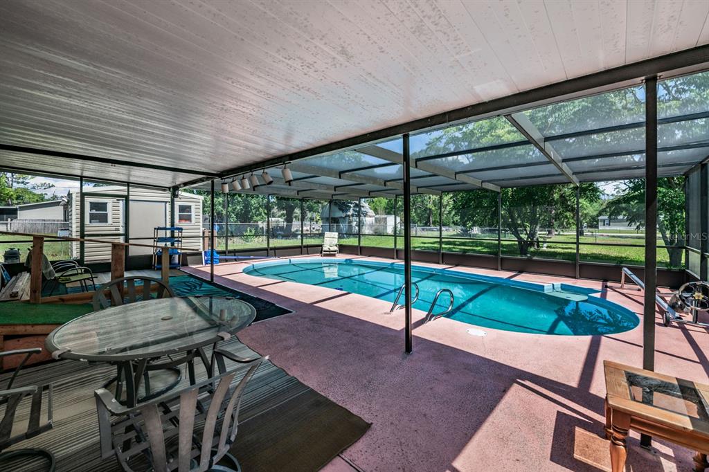 9739 Ray Street Hudson, FL 34669 - Photo 31 of 36 a house view with a sitting space and garden