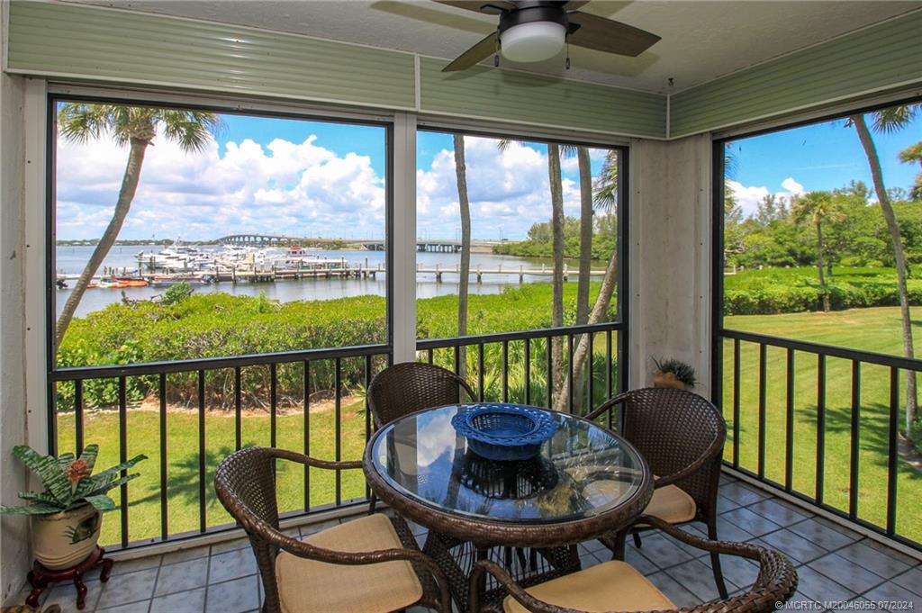 350 Northeast Edgewater Drive, Unit 202 Stuart, FL 34996 - Photo 13 of 28 a view of a city from a dining room with furniture window and outside view