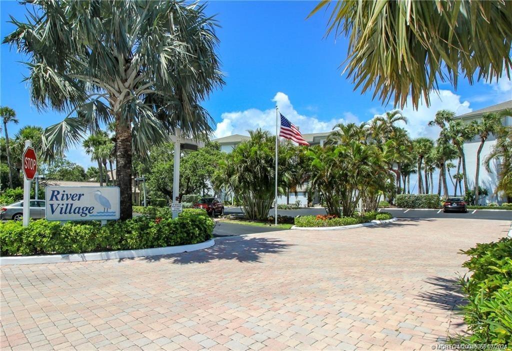 350 Northeast Edgewater Drive, Unit 202 Stuart, FL 34996 - Photo 2 of 28 a view of a park with palm trees
