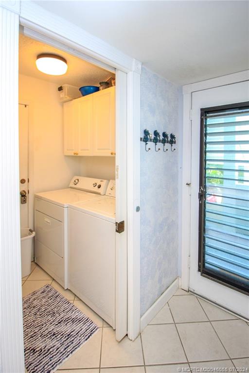 350 Northeast Edgewater Drive, Unit 202 Stuart, FL 34996 - Photo 22 of 28 a bathroom with a sink a toilet and shower