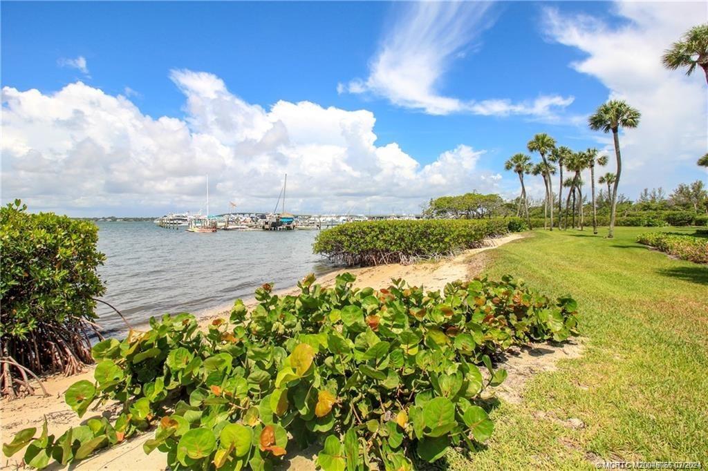 350 Northeast Edgewater Drive, Unit 202 Stuart, FL 34996 - Photo 28 of 28 a view of a lake with a big yard