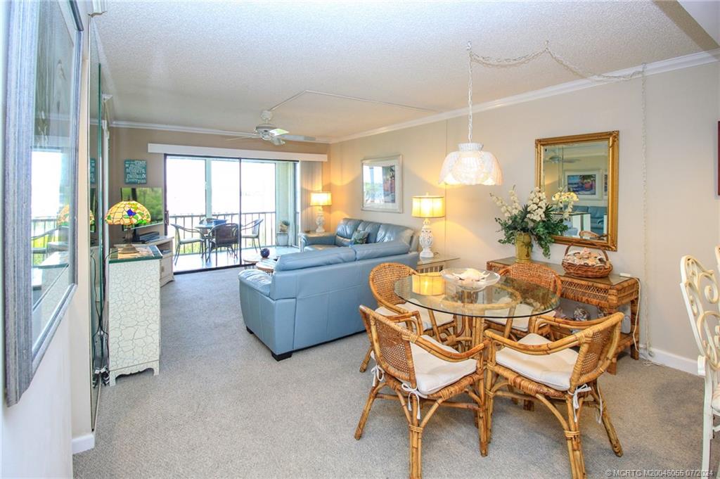 350 Northeast Edgewater Drive, Unit 202 Stuart, FL 34996 - Photo 9 of 28 a dining room with furniture and window