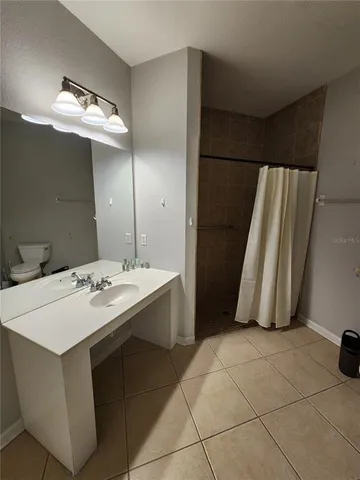 a bathroom with a sink a mirror and a bathtub