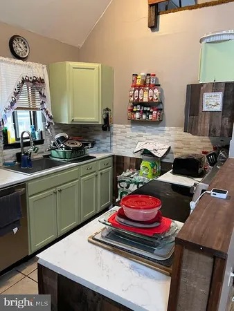 a kitchen with a stove and a sink