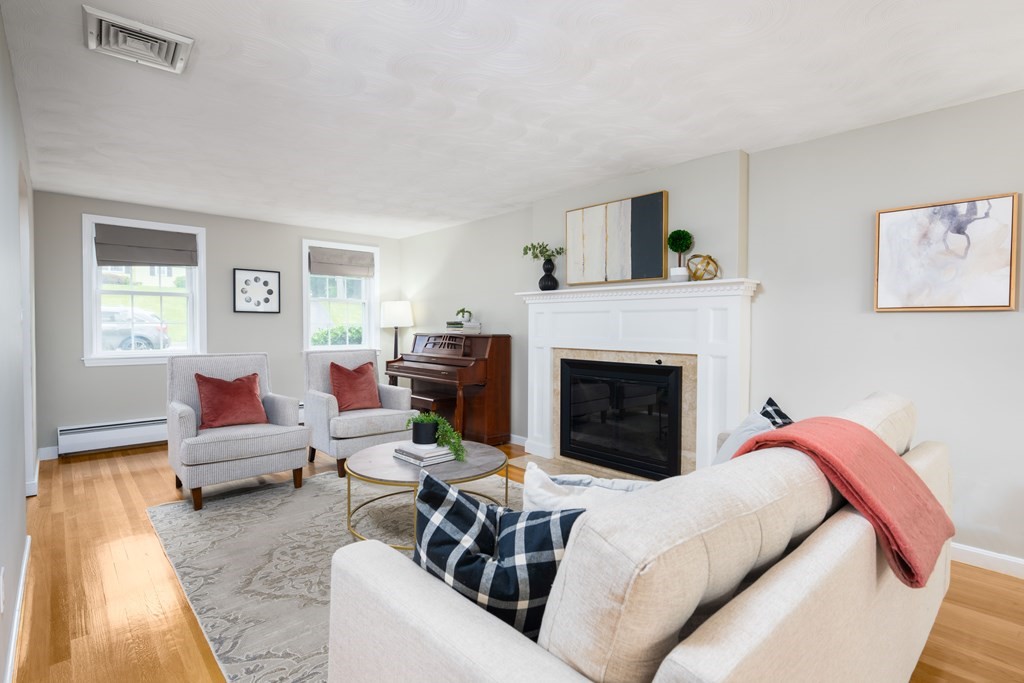 6 Old Meadow Lane Canton, MA 02021 - Photo 12 of 35 a living room with furniture and a fireplace