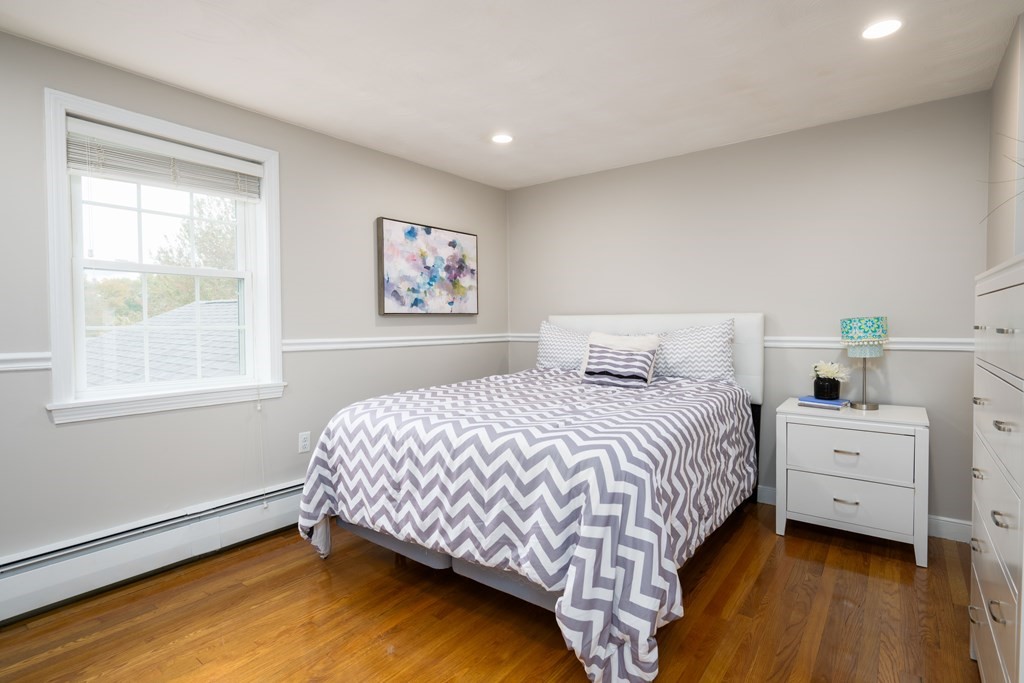 6 Old Meadow Lane Canton, MA 02021 - Photo 14 of 35 a bedroom with a bed and a window
