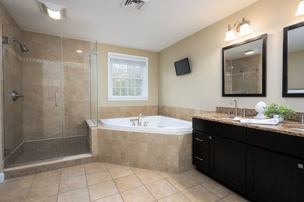 6 Old Meadow Lane Canton, MA 02021 - Photo 18 of 35 a bathroom with a tub sink shower and mirror