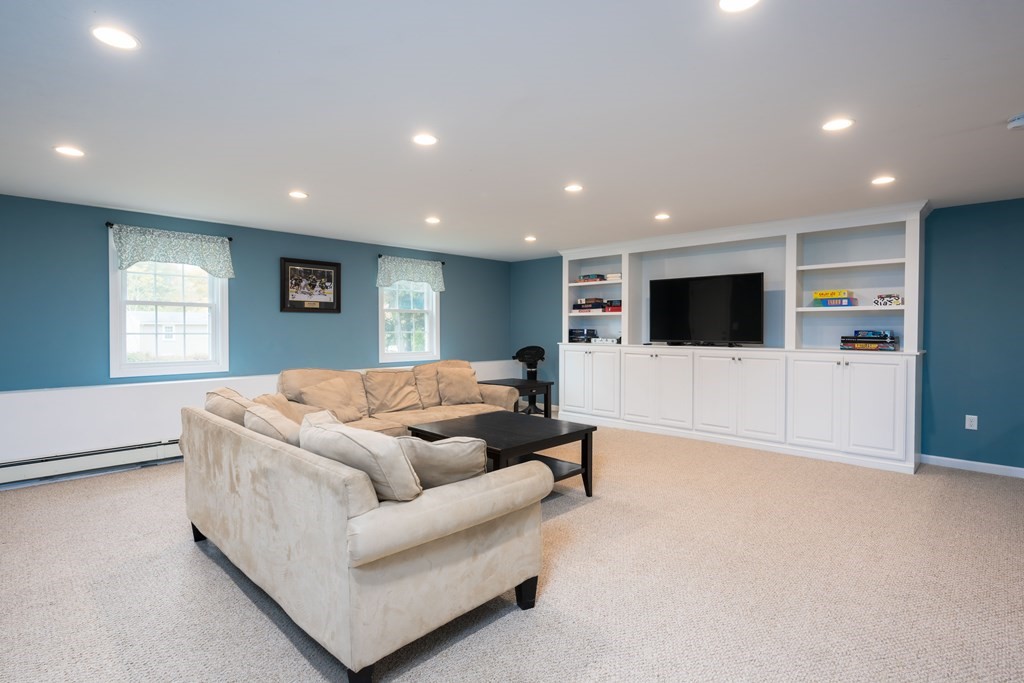 6 Old Meadow Lane Canton, MA 02021 - Photo 23 of 35 a living room with furniture and a flat screen tv