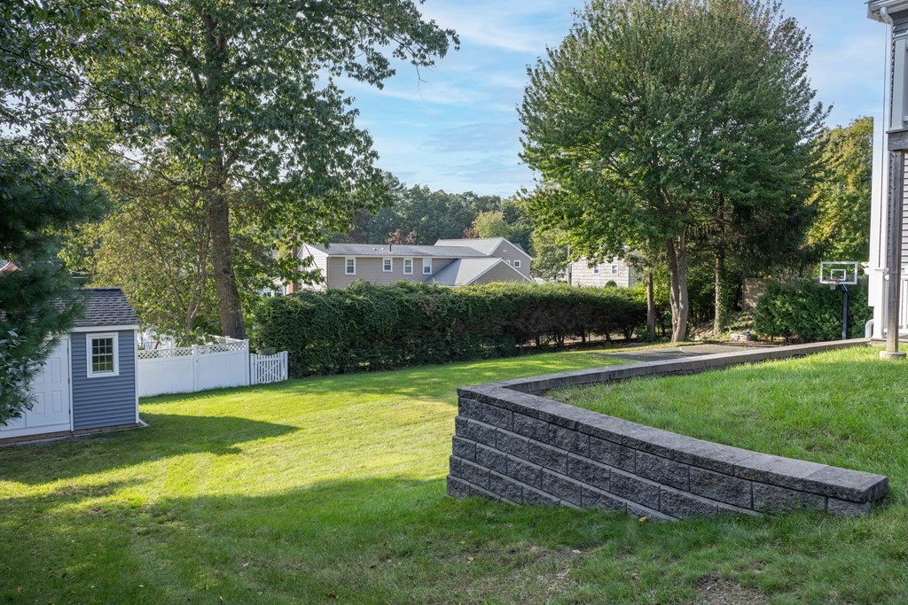 6 Old Meadow Lane Canton, MA 02021 - Photo 28 of 35 a view of a house with swimming pool and a yard